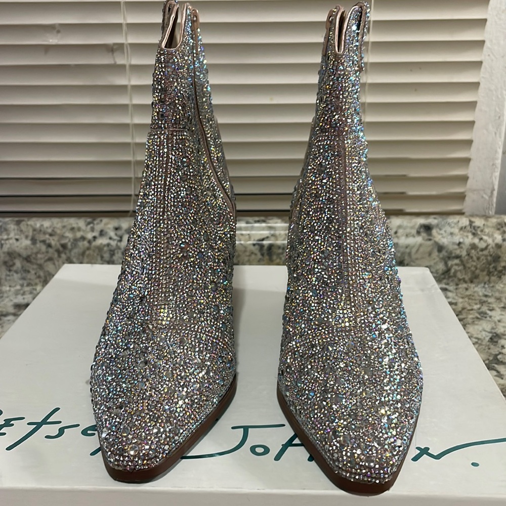 This is a short bedazzled cowboy boot made by Betsey Johnson.